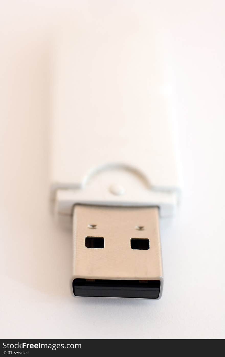 USB key detail photo, distance blur, white to pink background