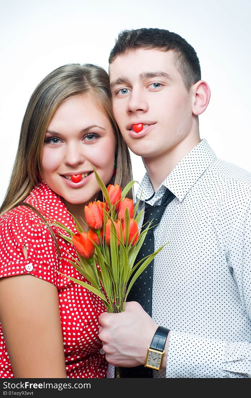 Happy couple with heart-shaped candies