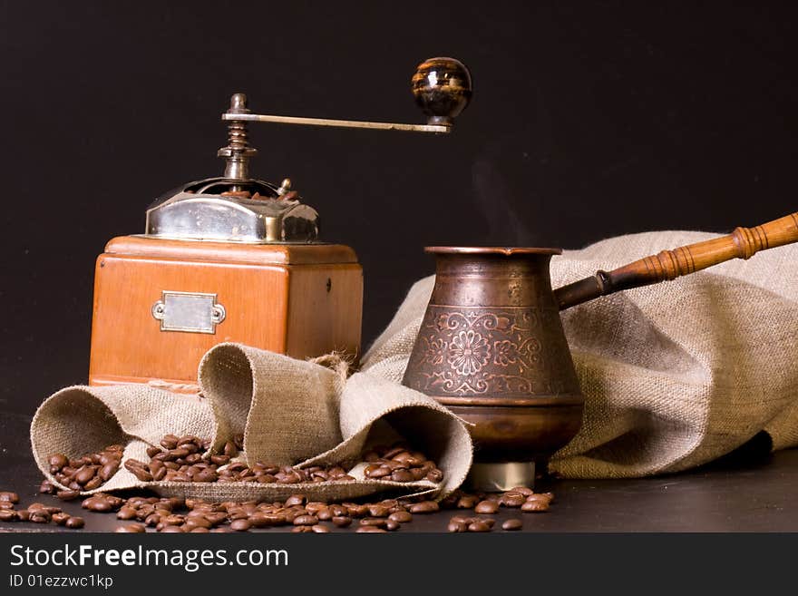 Retro coffee grinder on a black bacground