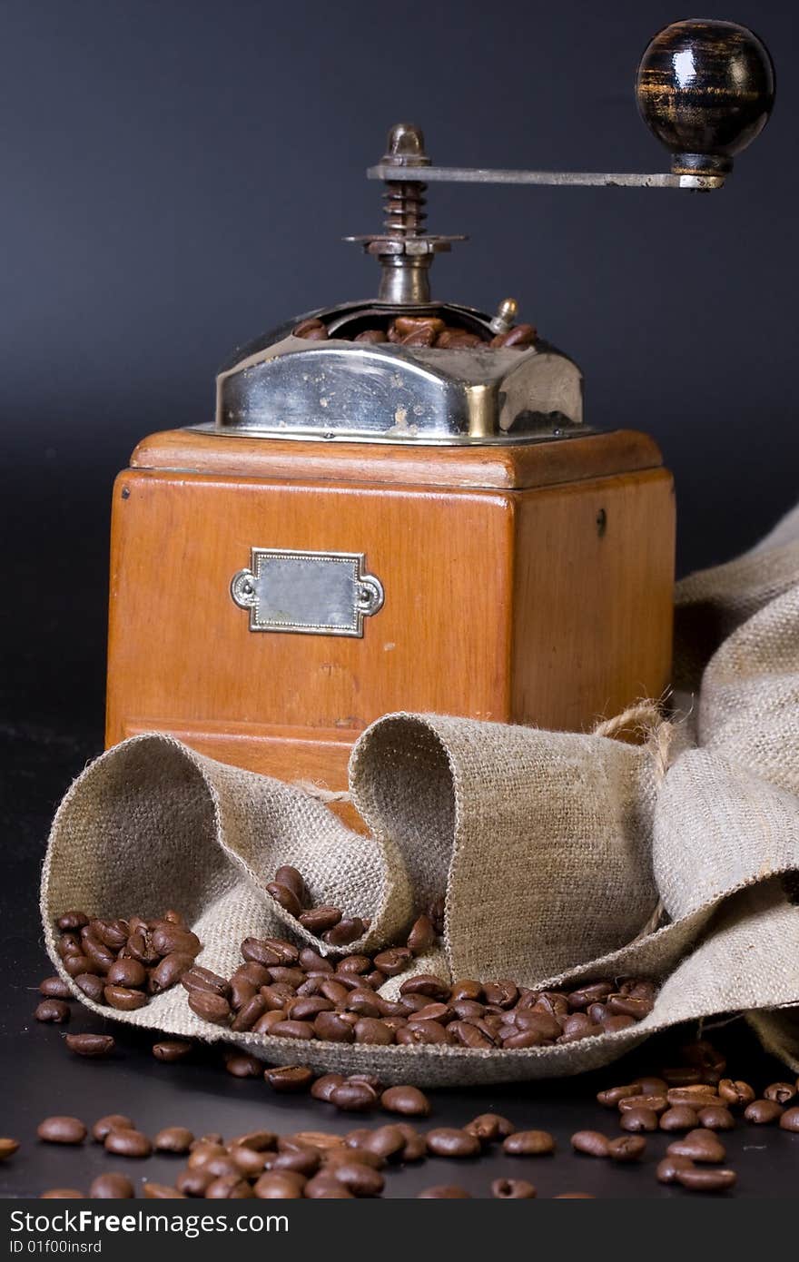 Retro coffee grinder on a black bacground