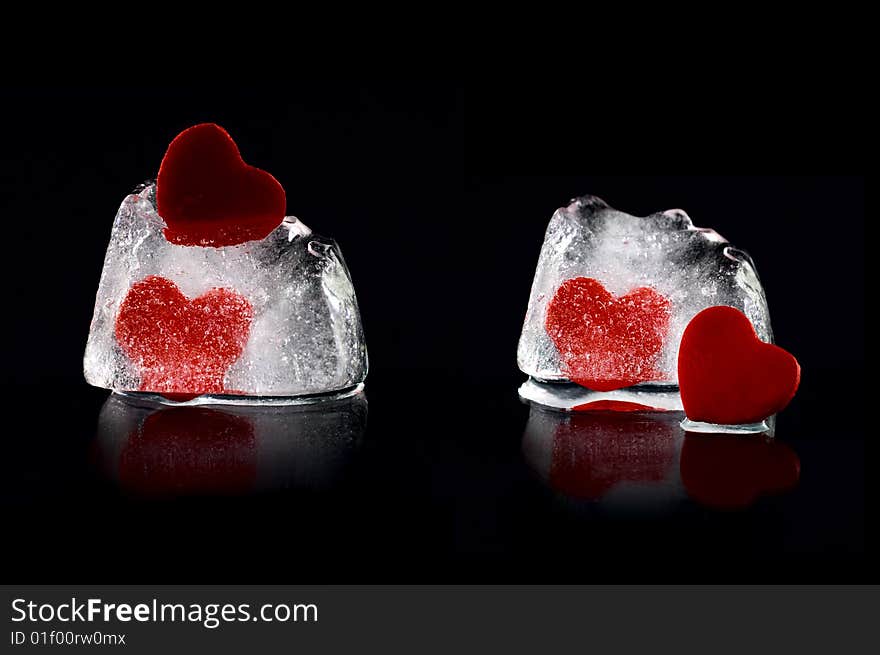 Four hearts in melting icecubes with medium reflection on black background. Four hearts in melting icecubes with medium reflection on black background