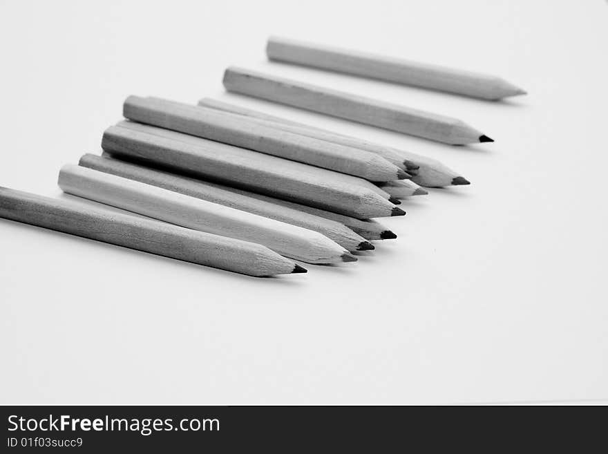 Pencils spread out over the table. Pencils spread out over the table