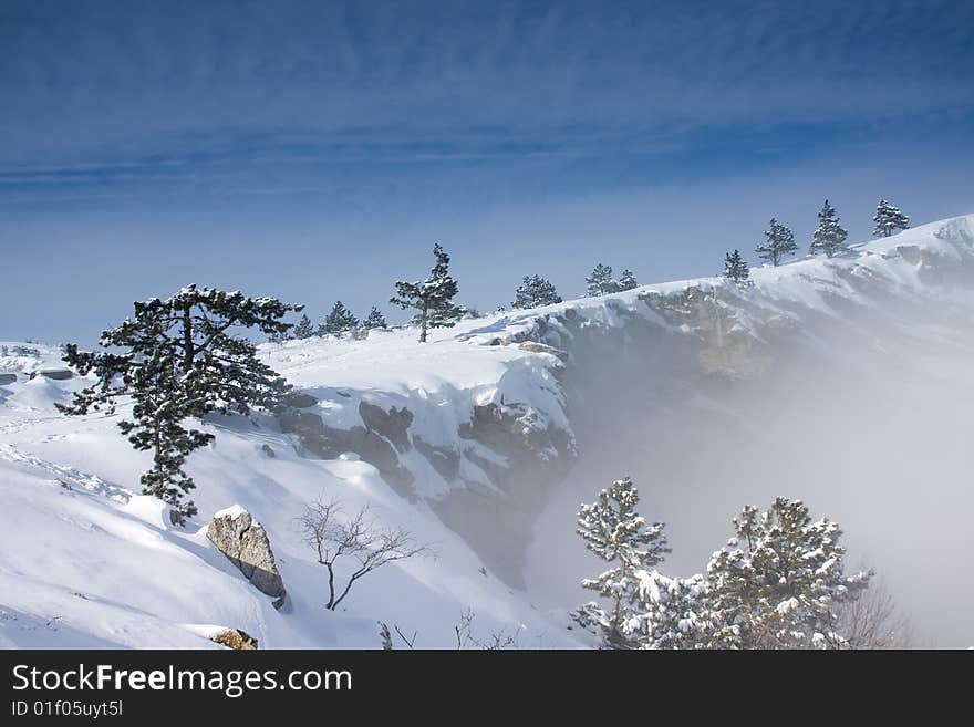 Mountain landscape with snow and trees. Mountain landscape with snow and trees