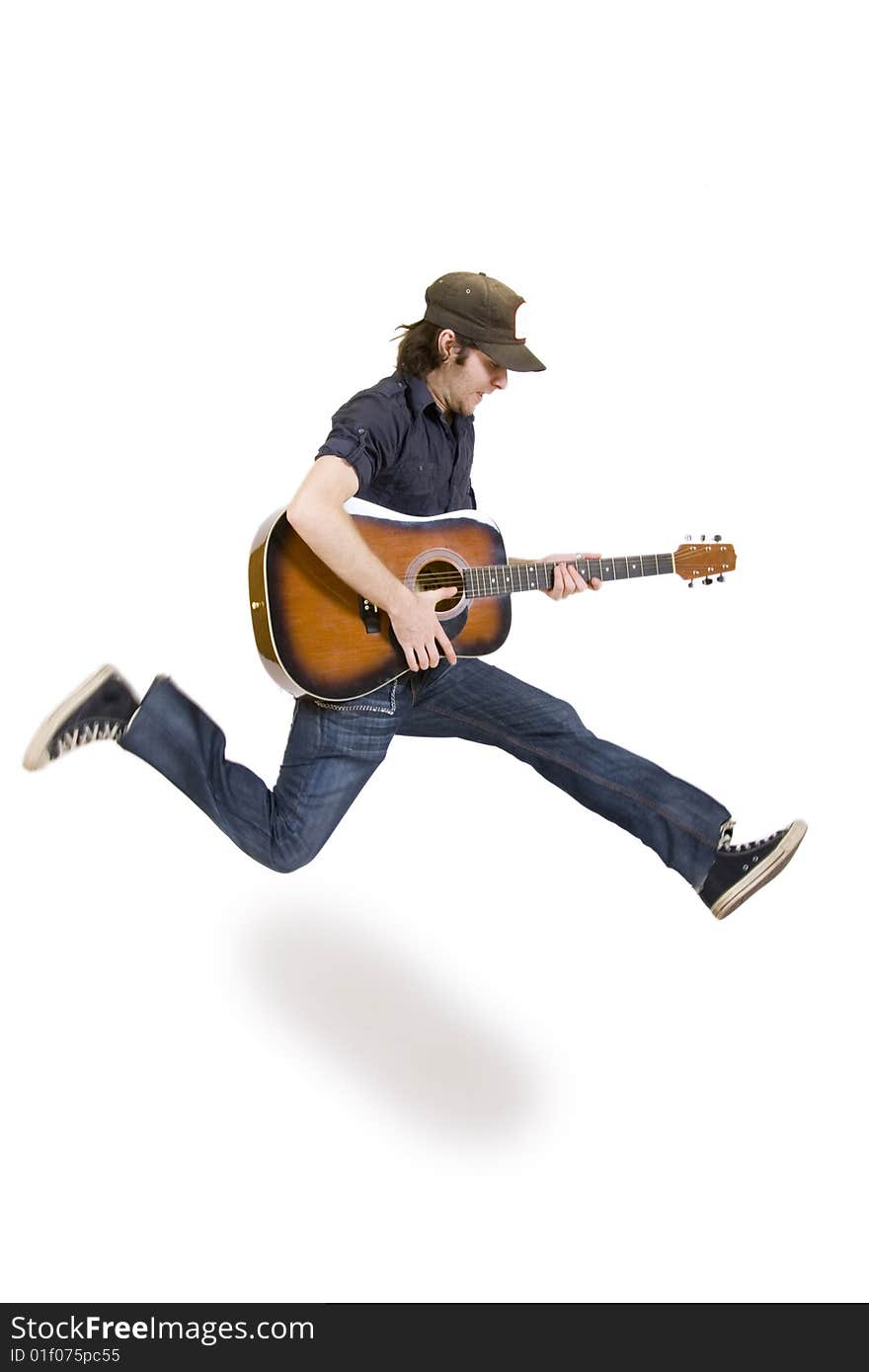 Passionate guitarist jumps on white background