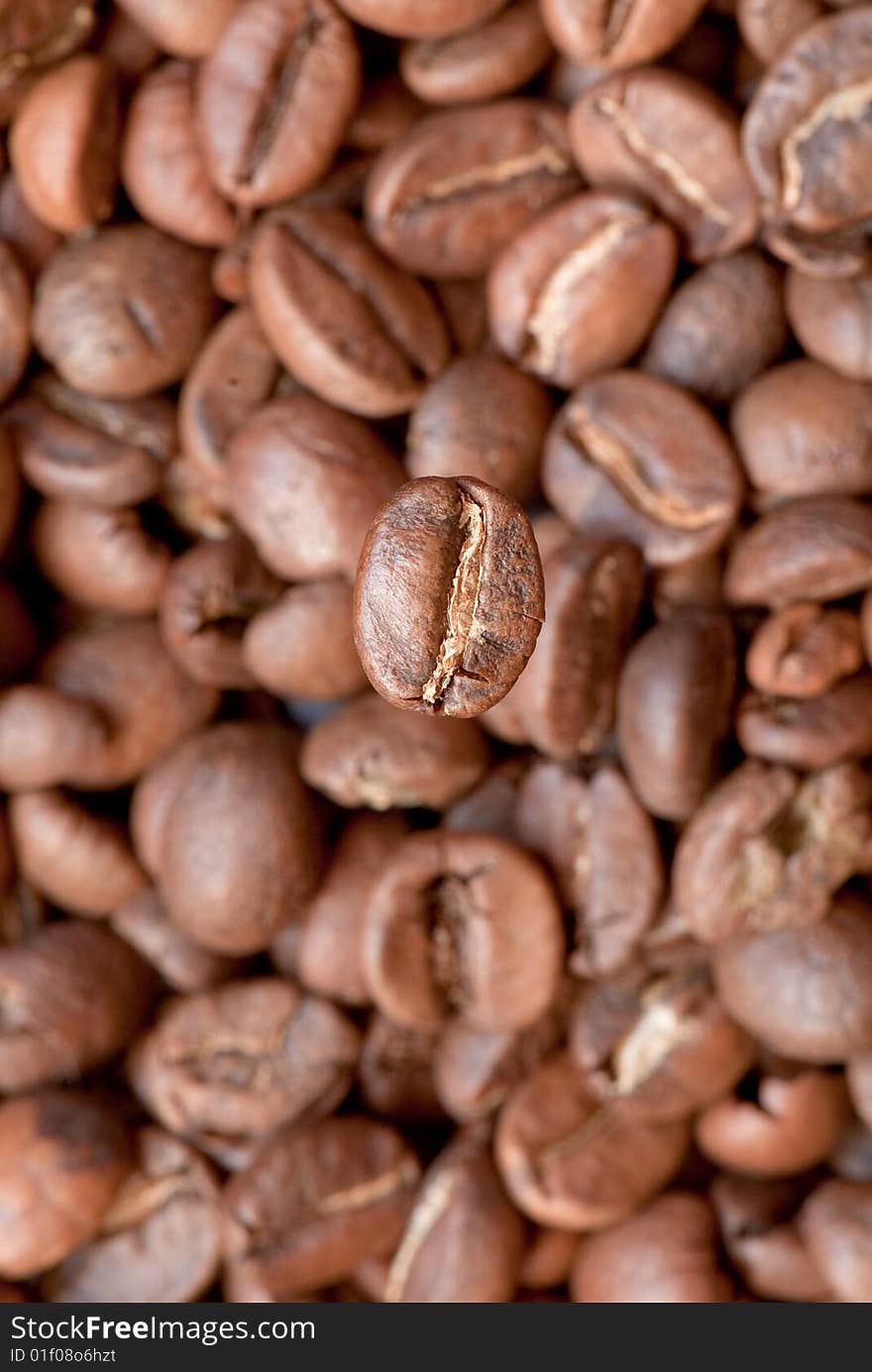 Background from the spilled grains of Brazilian coffee