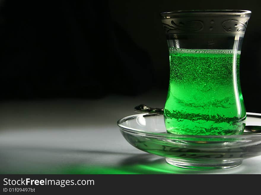 Turkish glass with a green tea