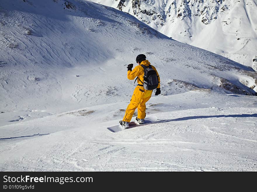 Snowboarder Looking Down The Slope. Sunny DaySnowb