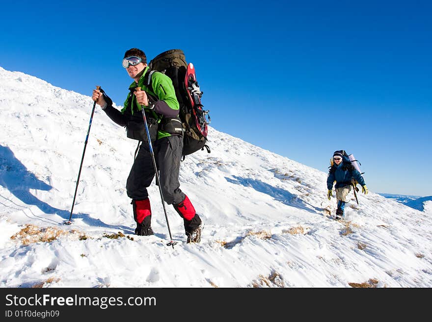 Hiker are in winter in mountains