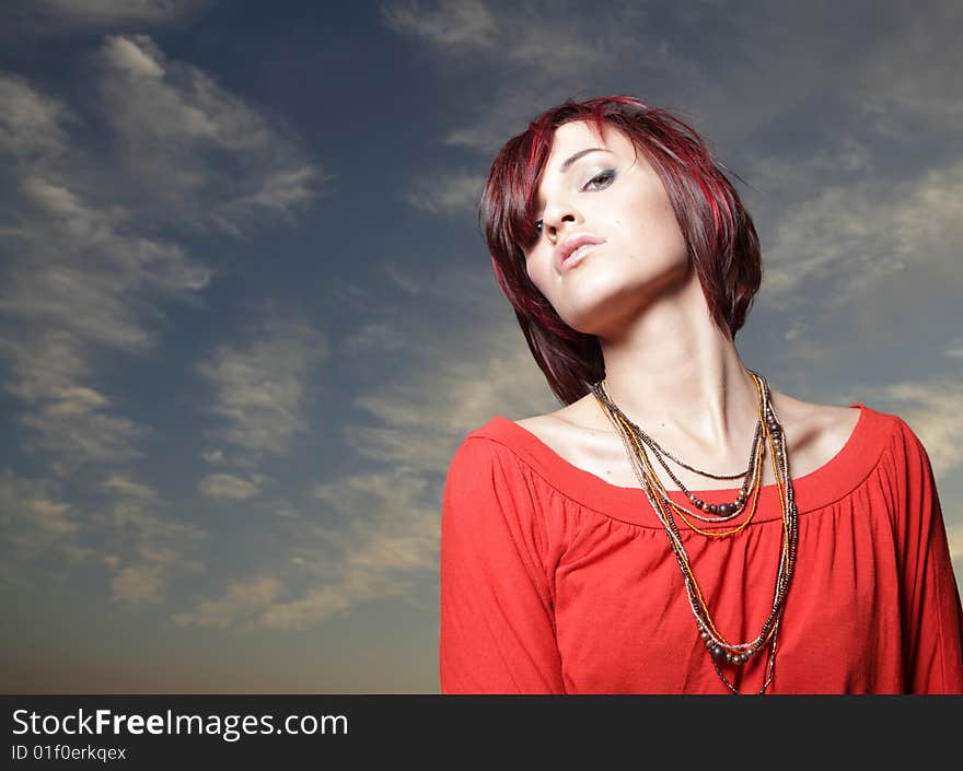 Young woman posing in a red shirt. Young woman posing in a red shirt