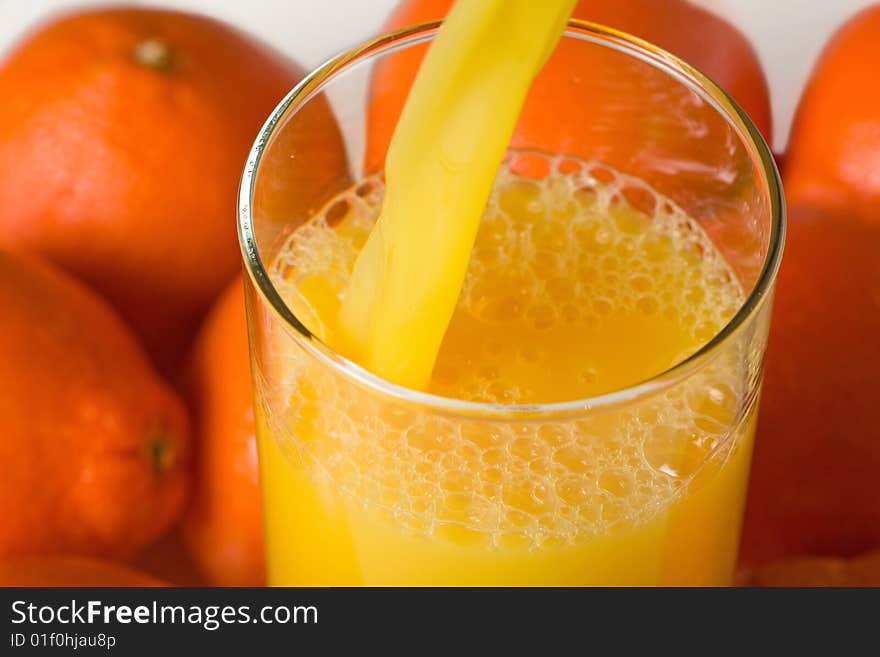 Pouring A Glass Of Orange Juice