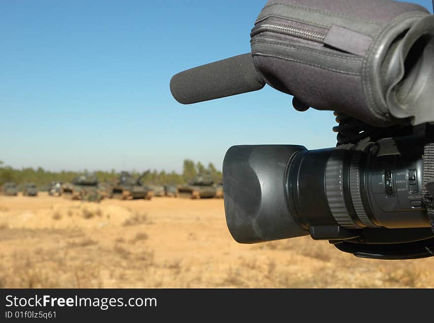 Shooting war with military vehicle´s on background