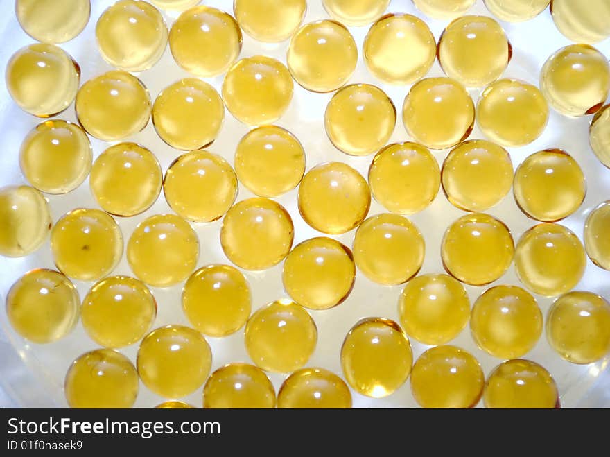 Yellow vitamin capsules