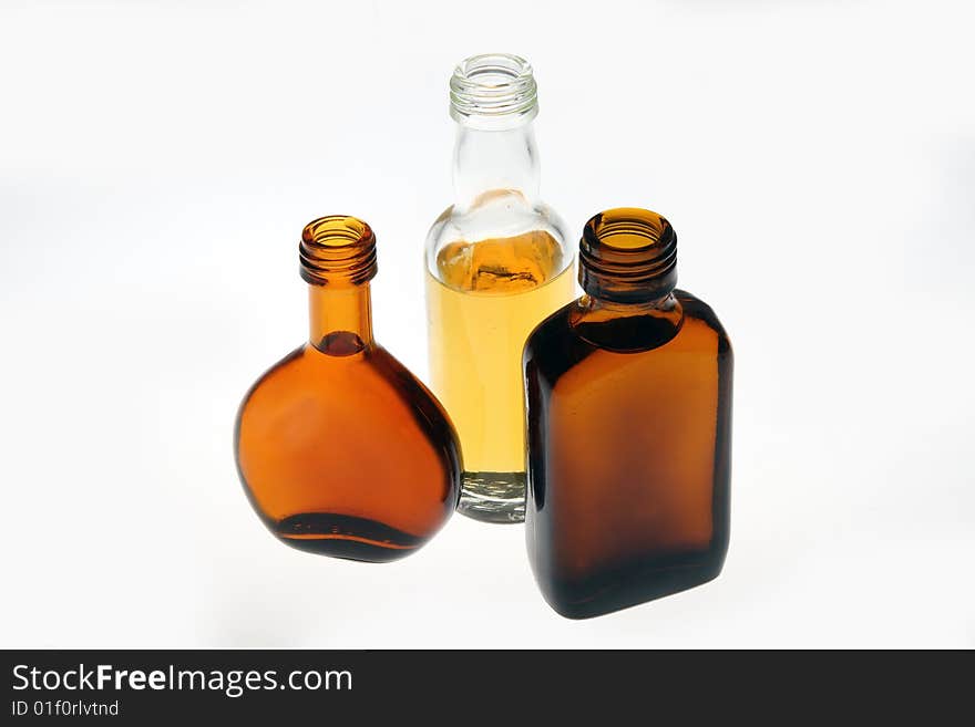 Whiskey bottles of different shapes in white background