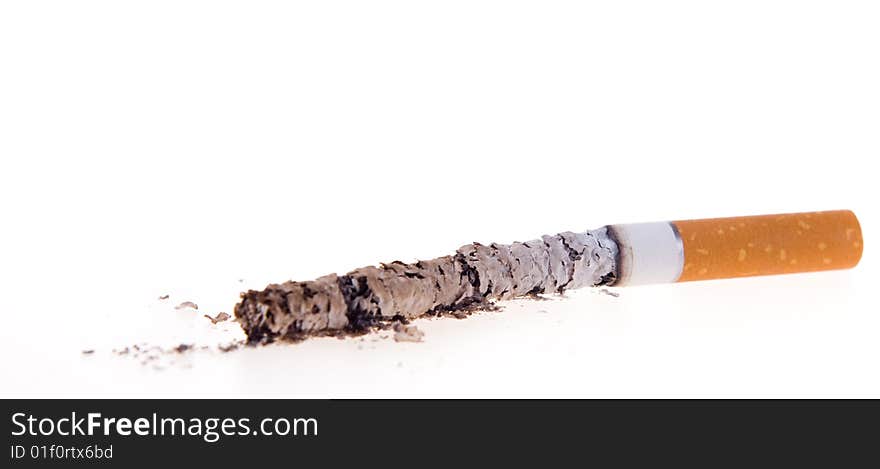 Cigarettes, which was burnt down, on white background, with the ashes that are scattered. Cigarettes, which was burnt down, on white background, with the ashes that are scattered