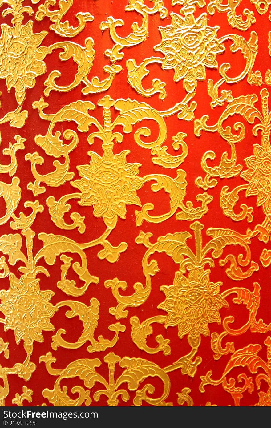 Closeup golden Chinese mosaic with red background