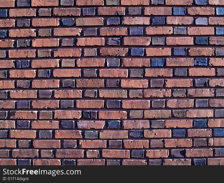 Multi-colored and duo-sized, old exterior brick wall. Multi-colored and duo-sized, old exterior brick wall.