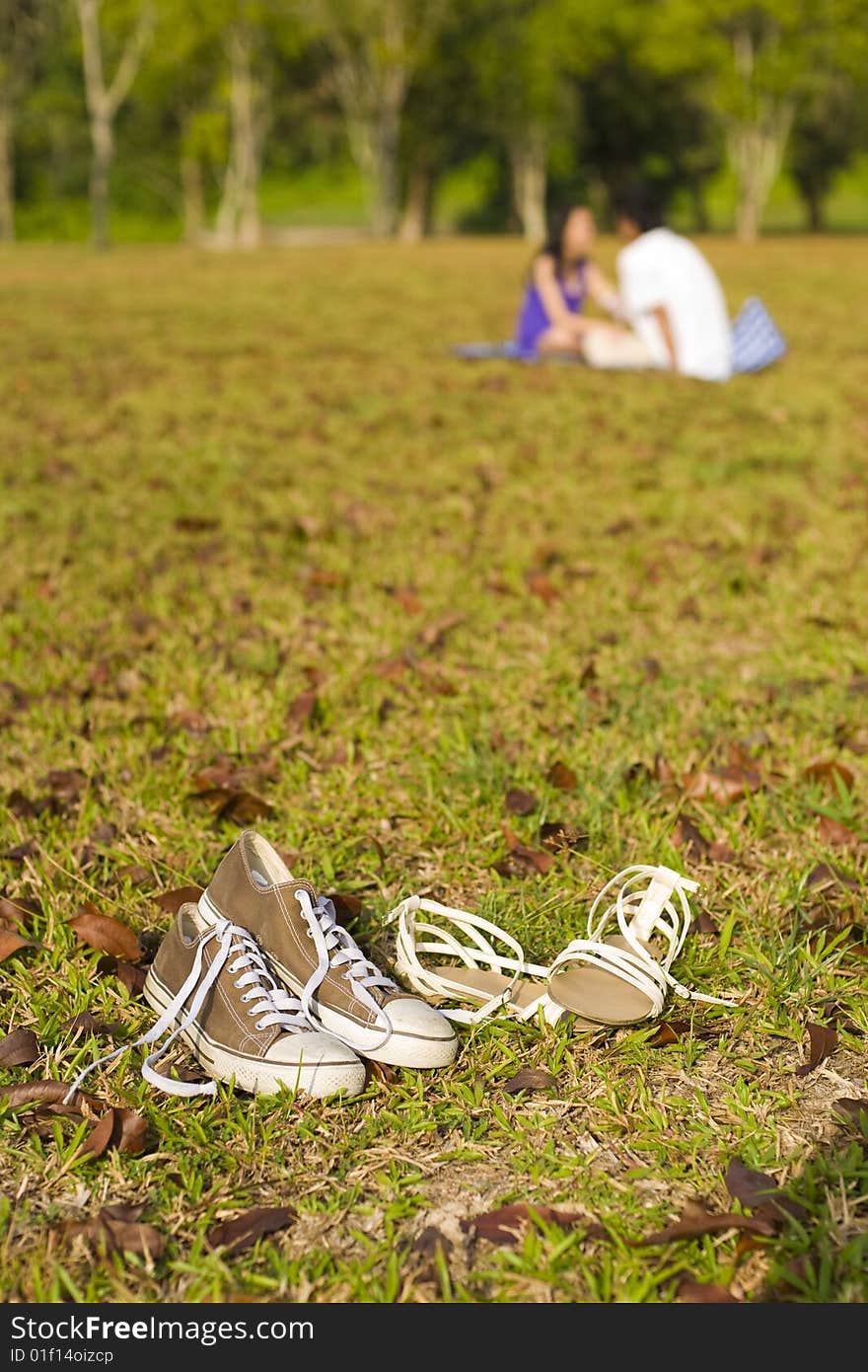 A loving couple enjoying intimate moments in the outdoor. A loving couple enjoying intimate moments in the outdoor