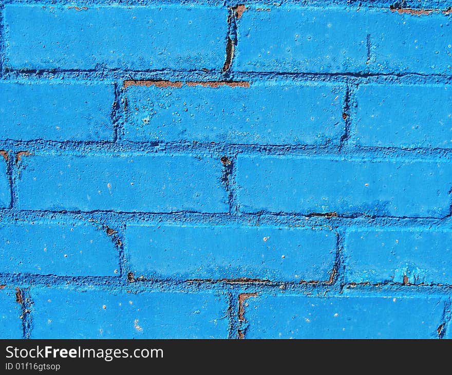 Blue paint on bricks make a nice display of texture and color on a city wall. Blue paint on bricks make a nice display of texture and color on a city wall.