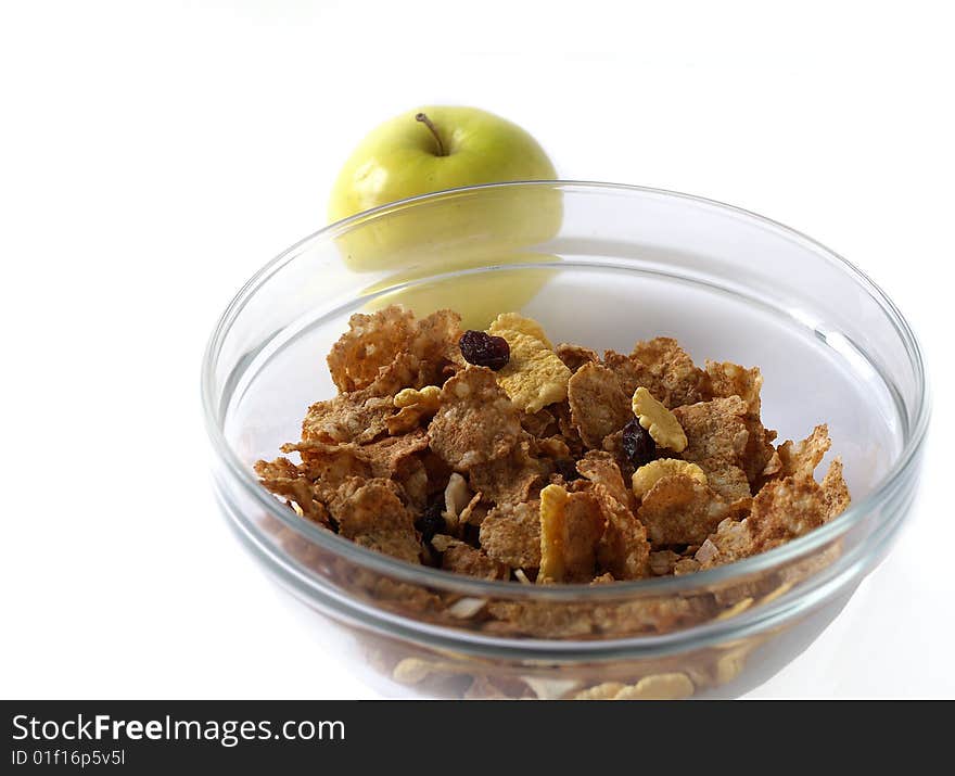 Delicious muesli in a glanse dish with apple isolated