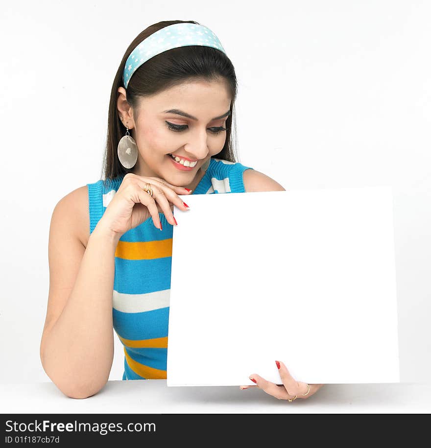 Beautiful young asian female with a blank placard