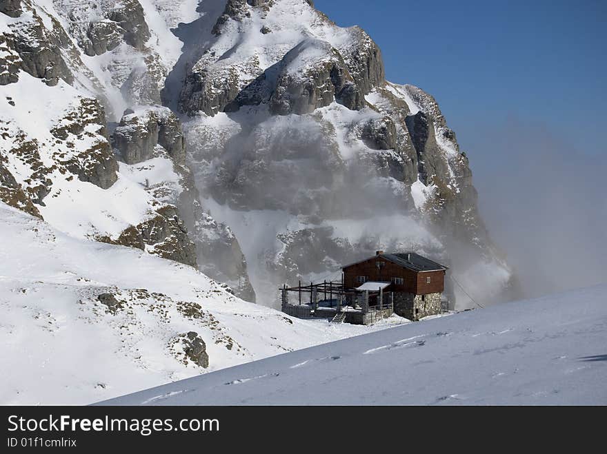 Mountain hut in winter,in Bucegi mountains,Romania