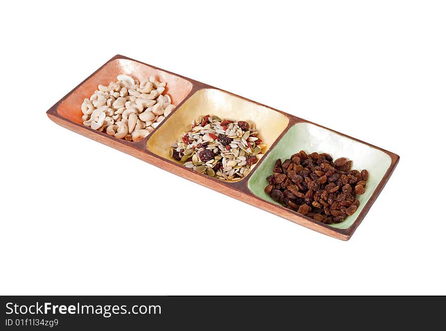 Healthy snack food in a colorfull serving bowl isolated against a white background. Healthy snack food in a colorfull serving bowl isolated against a white background.