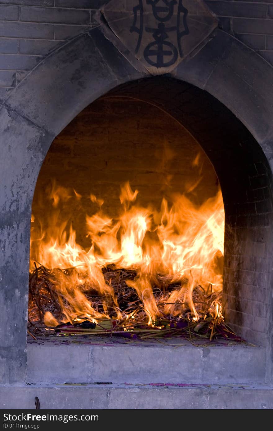 Fire burning incense in a Buddhist shrine. Fire burning incense in a Buddhist shrine