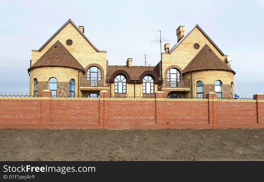 New modern brick fencing cottages in a row. New modern brick fencing cottages in a row