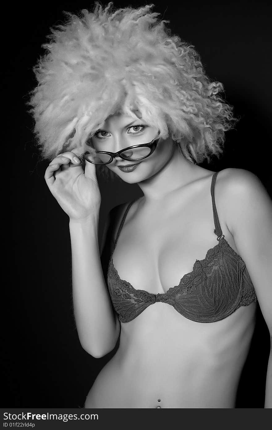 Girl in glasses and furry hat, grayscale