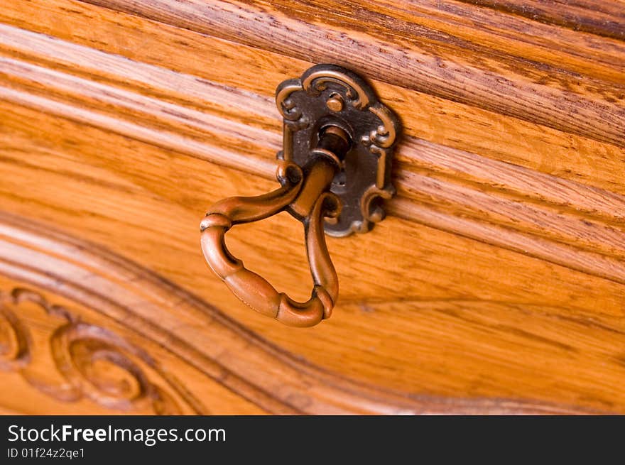 Antique key in locked door