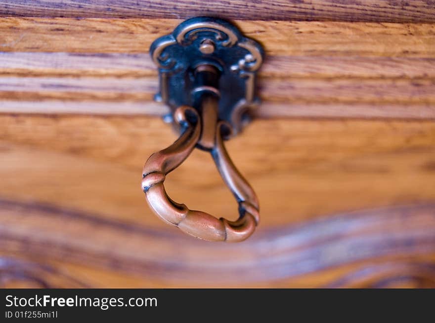 Antique key in locked door