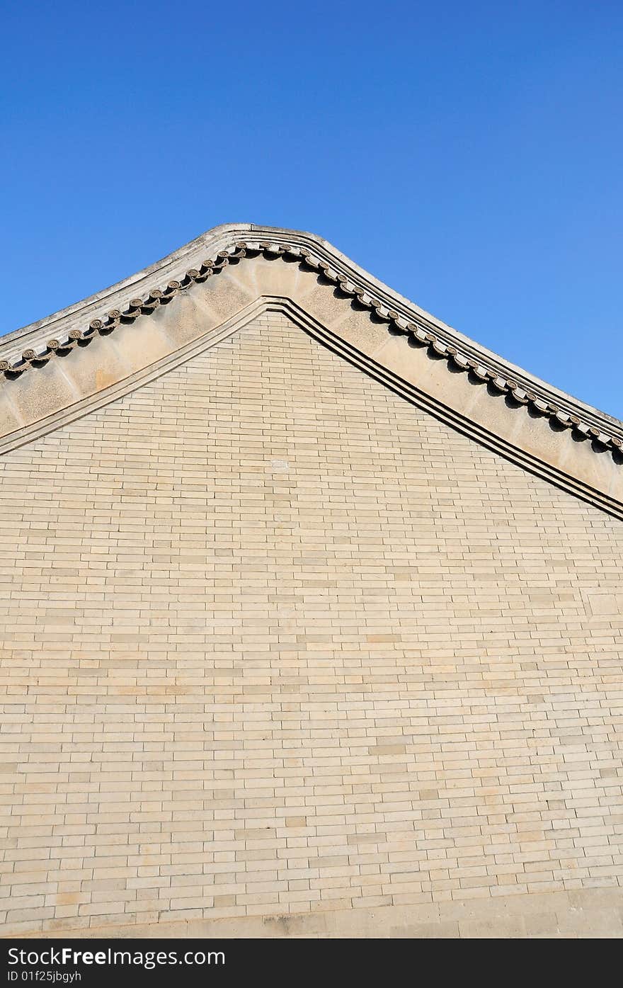 Gray wall under blue sky