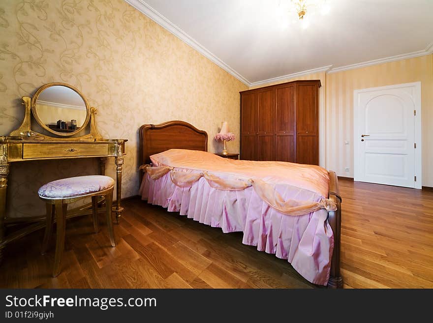 Bedroom with dressing table in modern apartment