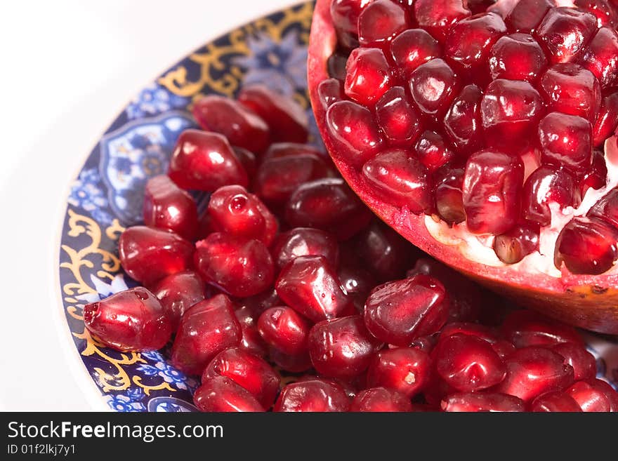 Broken ripe pomegranate fruit red