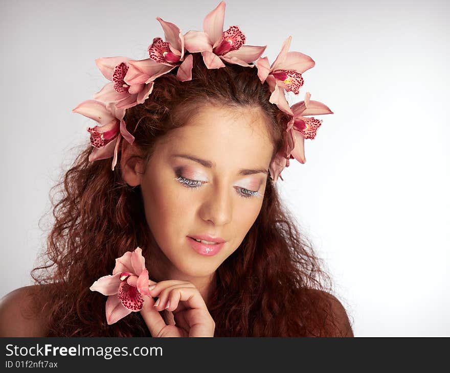 Portrait of the girl looking downwards with a flower. Portrait of the girl looking downwards with a flower