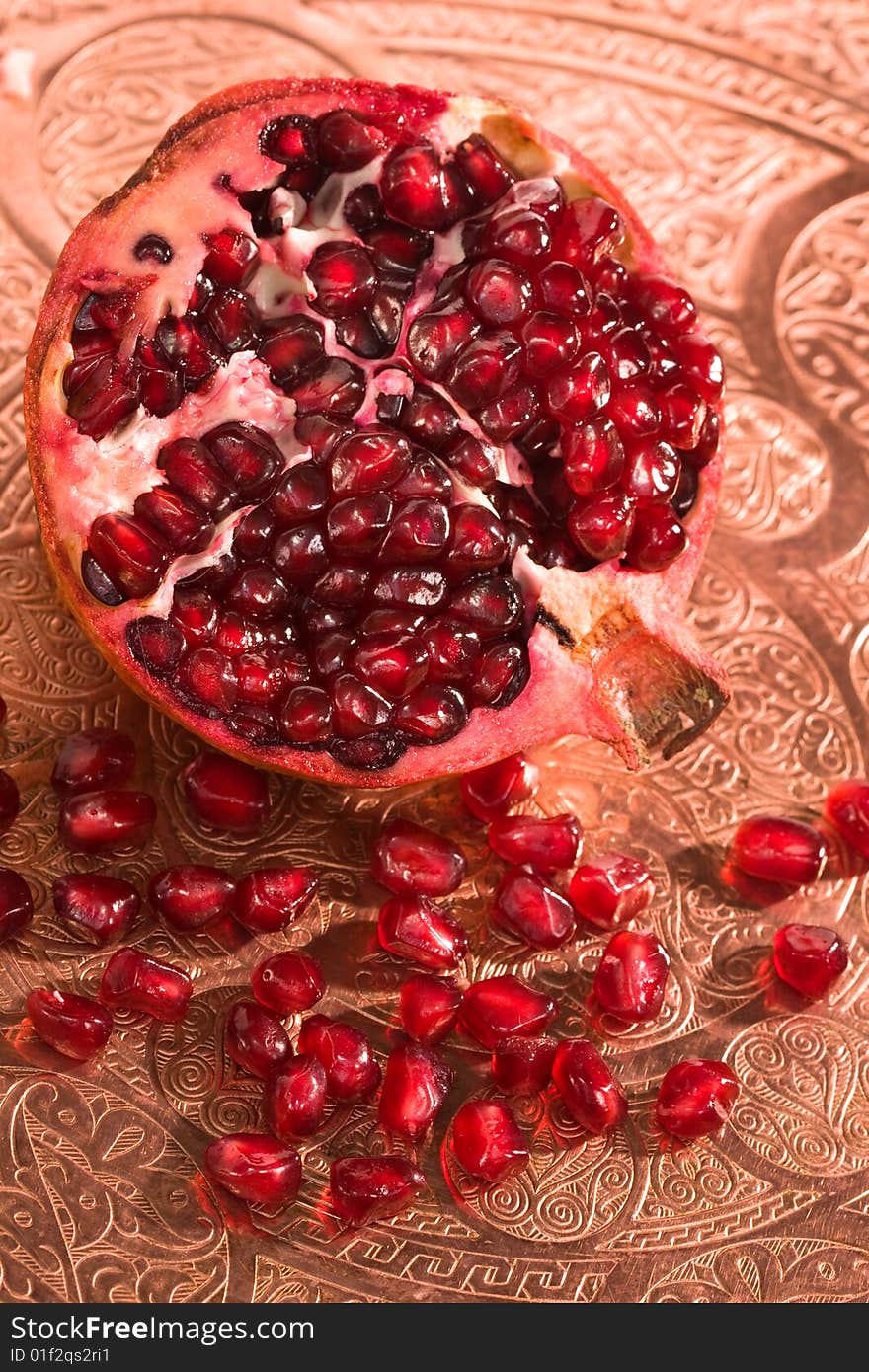 Broken ripe pomegranate fruit red