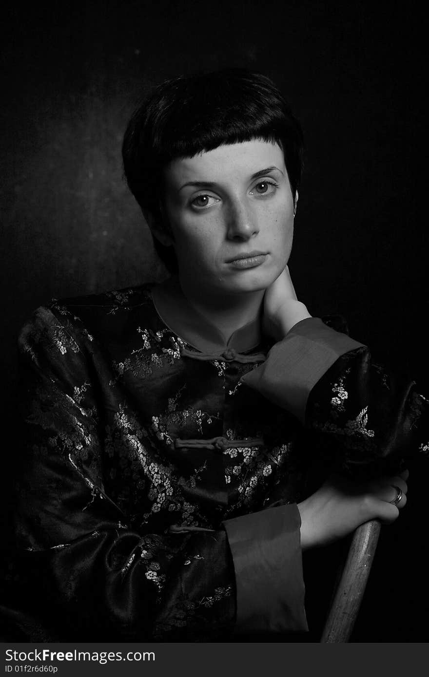 Low key black and white portrait of a young woman. Low key black and white portrait of a young woman