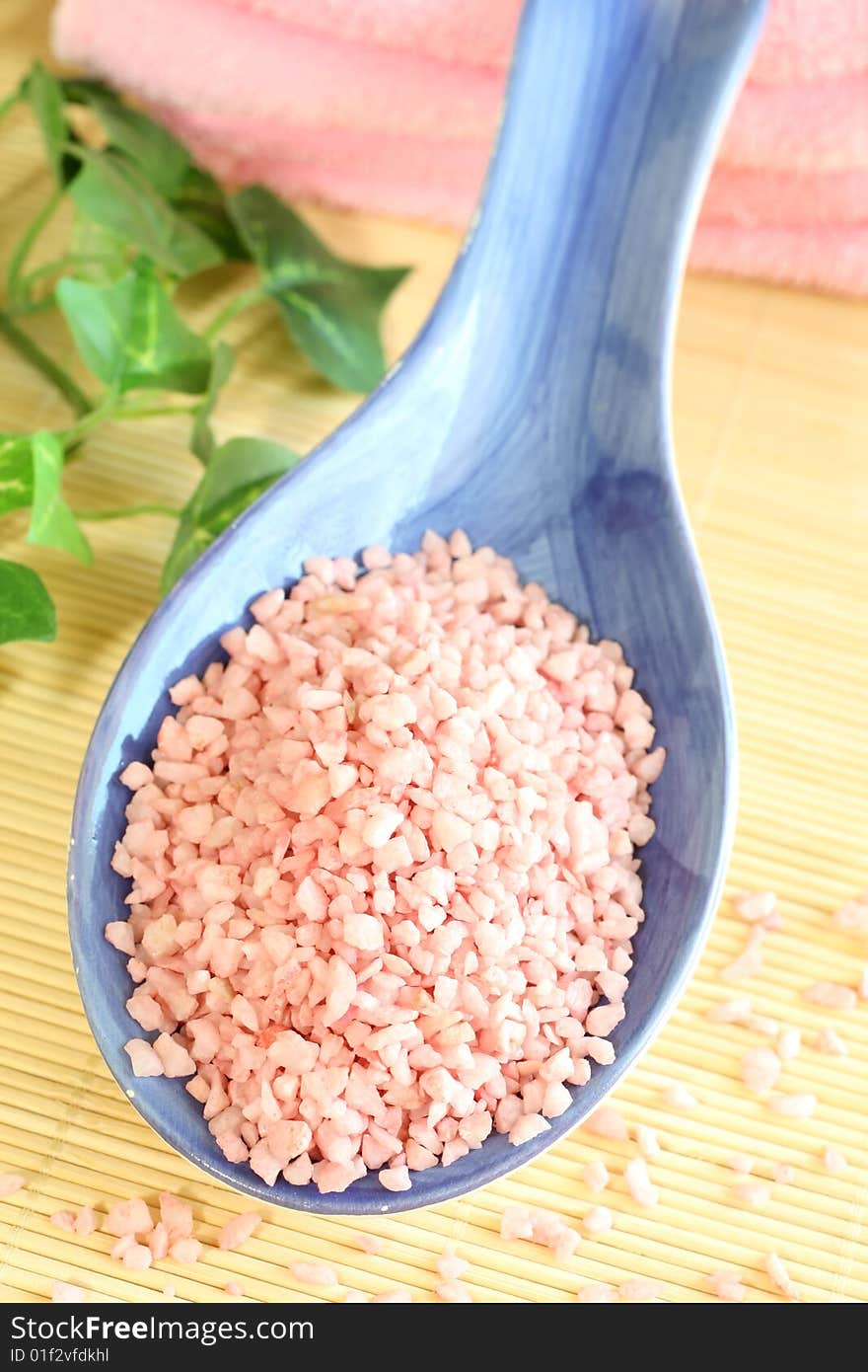 spa background, pink bath salts and towel