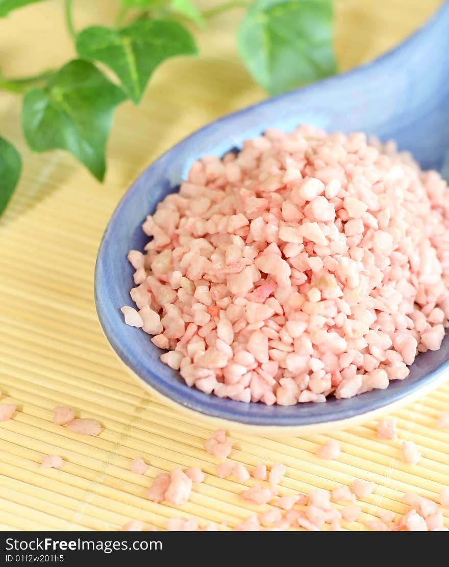 Spa background, pink bath salts and towel