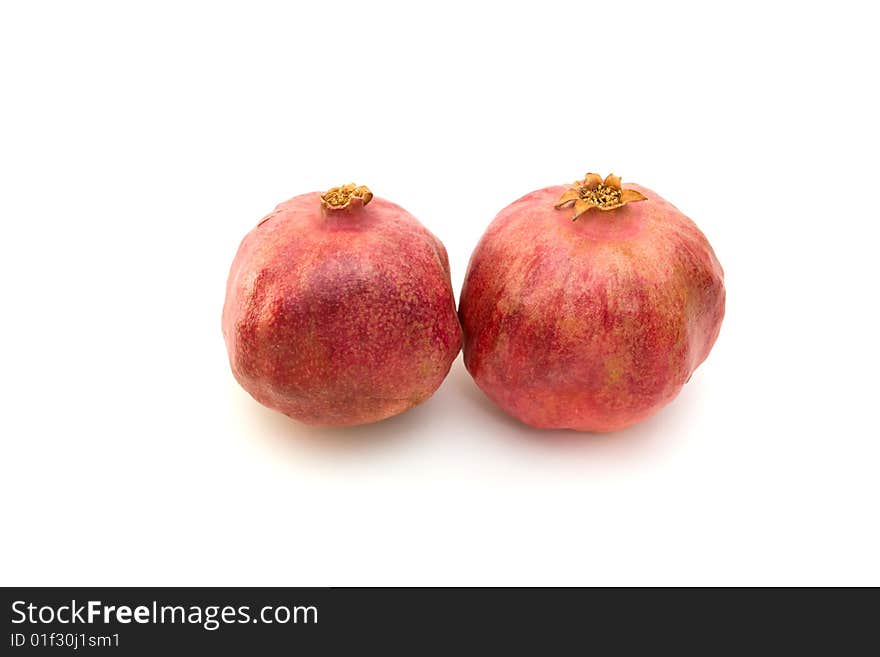 Two red pomegranate isolated on white. Two red pomegranate isolated on white