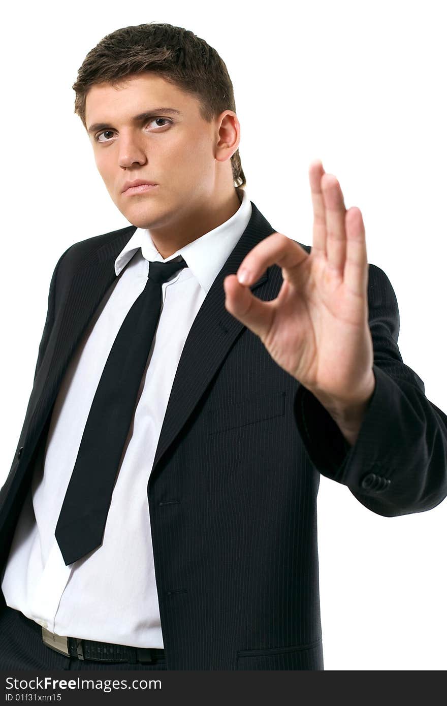 Businessman showing ok sign on white background