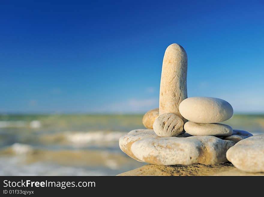 Sea pebble in morning light on a beach in the summer. Sea pebble in morning light on a beach in the summer