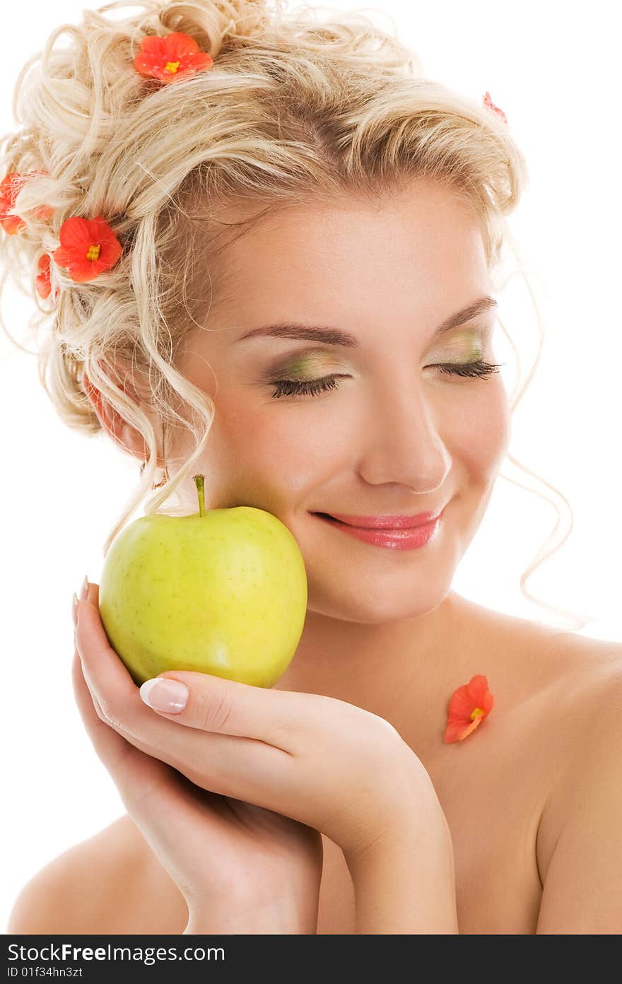 Beautiful young woman with ripe green apple. Spring concept