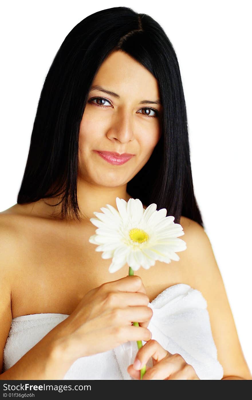 Beautiful young spa woman holding a flower against white. Beautiful young spa woman holding a flower against white.