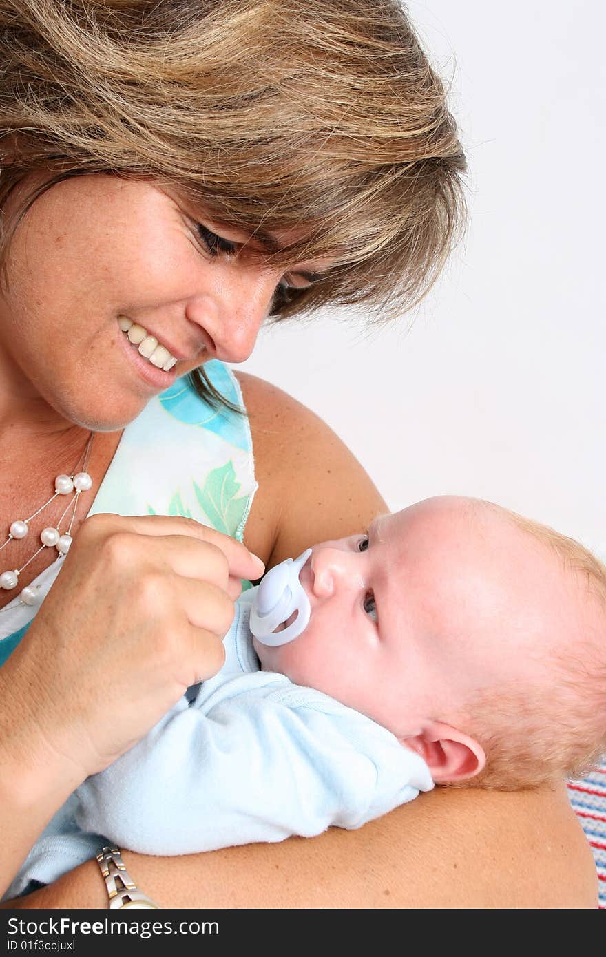 Baby boy cuddled by his friendly auntie