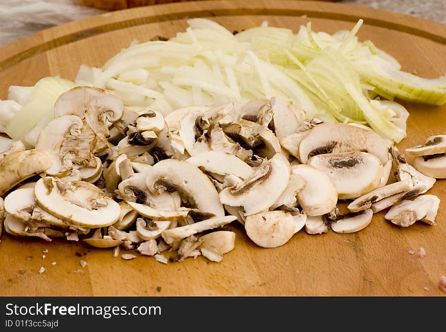 Champignons with bulb on kitchen table