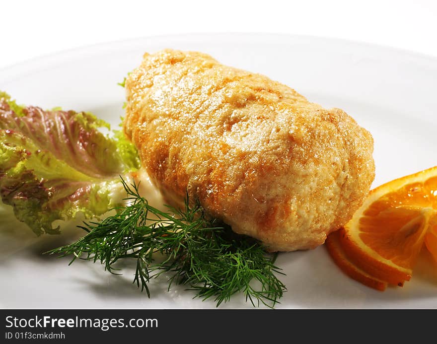 FIlleted Chicken (or Beef) Plate Served with Orange Slice and Salad Leaves. Isolated on White Background