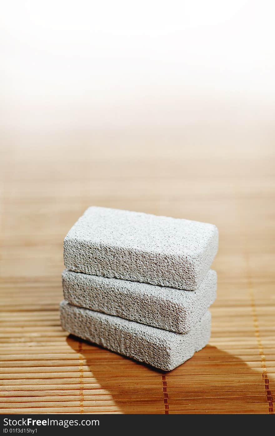 Stack of pumice stones on top of a bamboo mat. Stack of pumice stones on top of a bamboo mat.