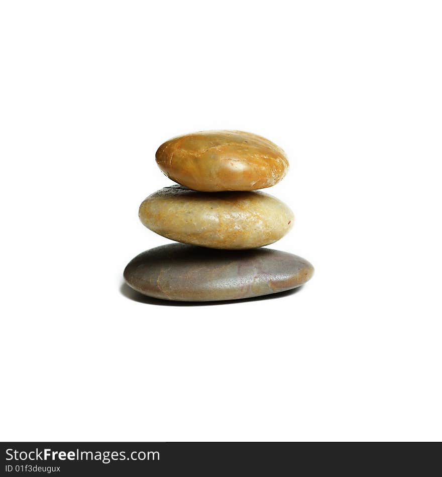 Stack of stones against a white background. Stack of stones against a white background.