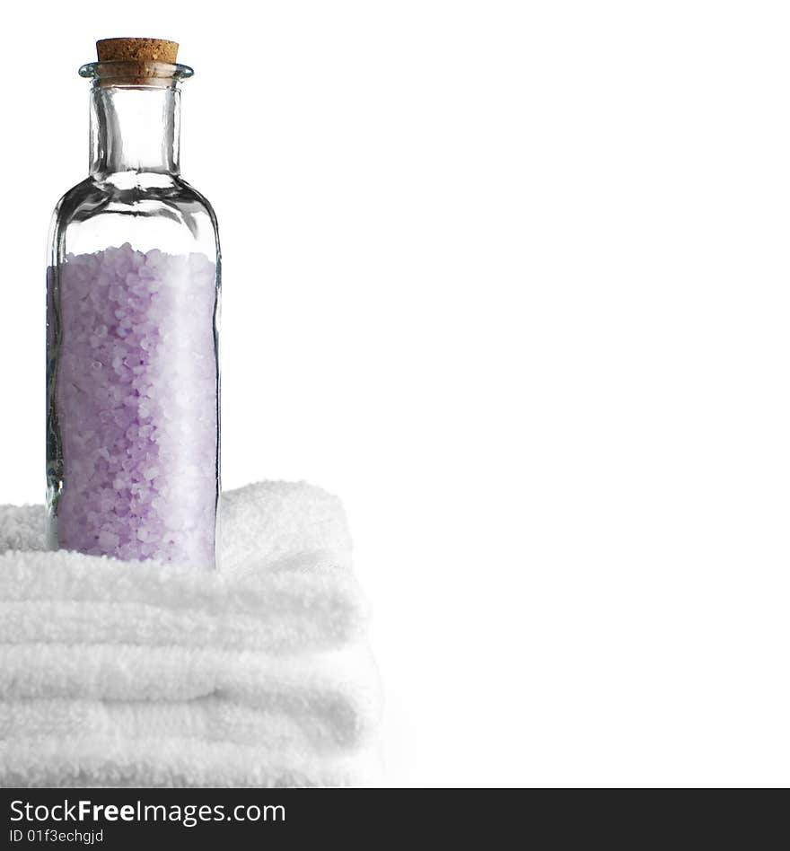 Bath towels and bath salt against a white background. Bath towels and bath salt against a white background.